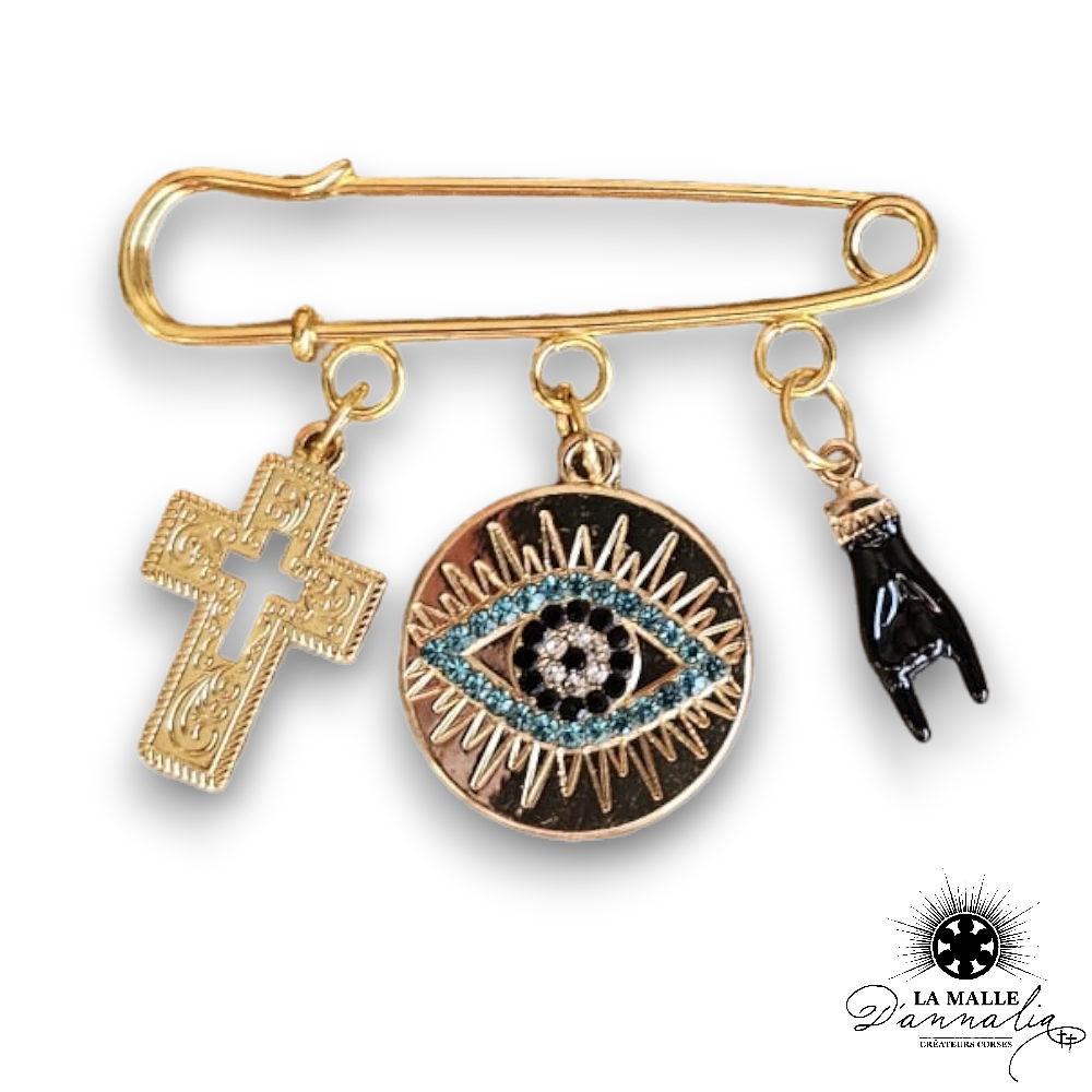 broche fantaisie corne oeil croix
